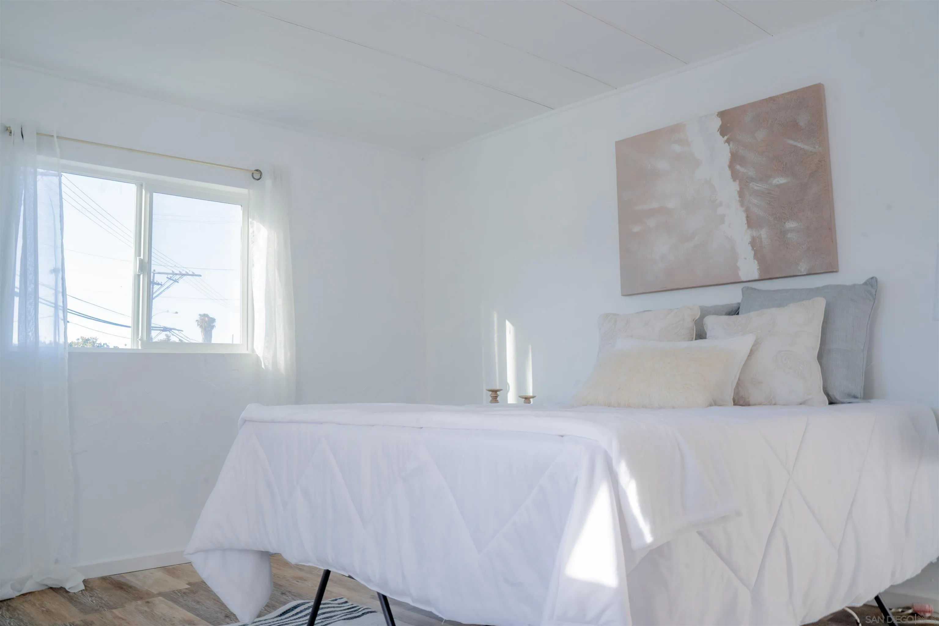 3221 Bancroft Drive, Unit SPC 1 Spring Valley, CA 91977 - Photo 12 of 22 a bedroom with a bed and a lamp