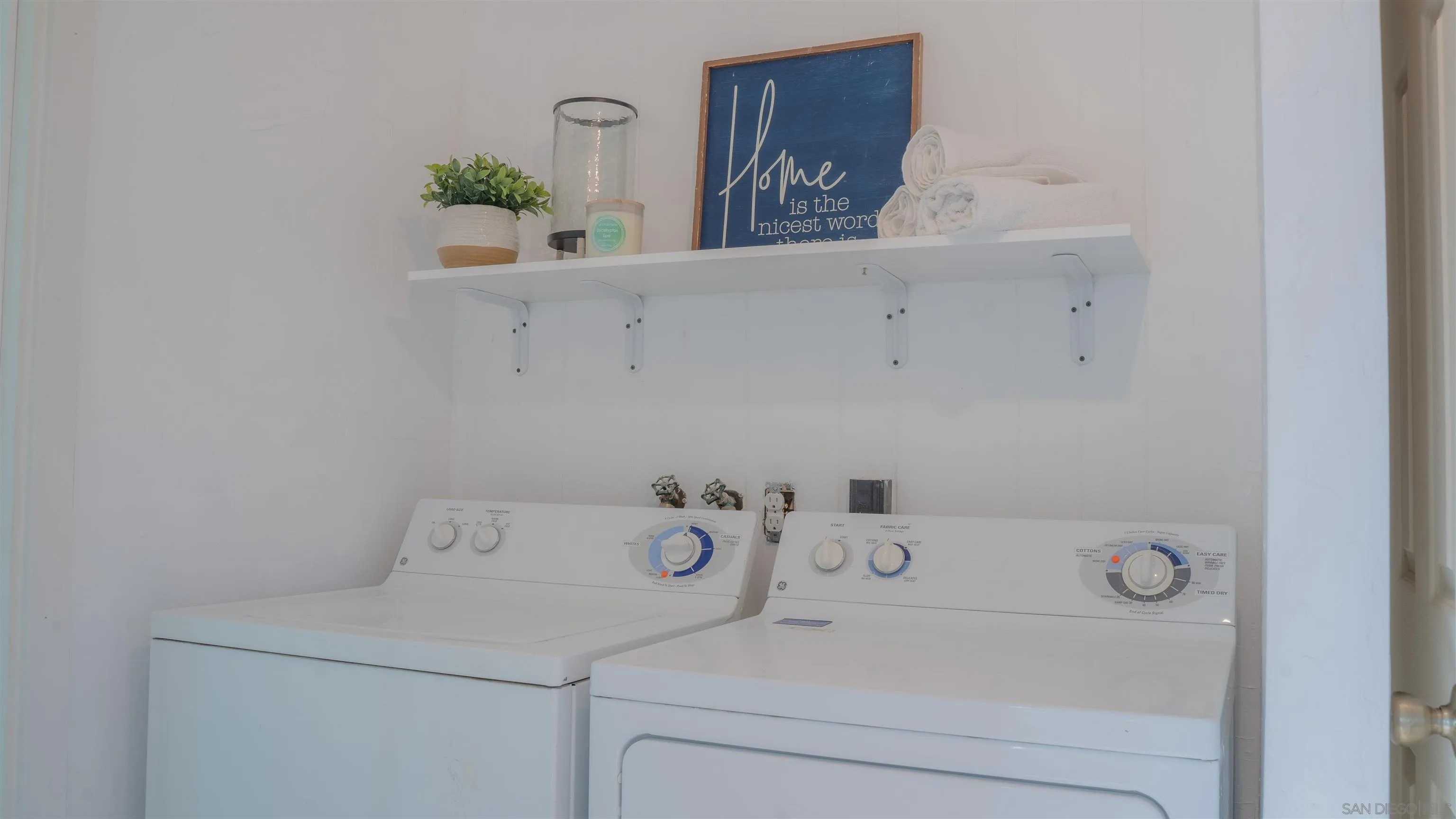 3221 Bancroft Drive, Unit SPC 1 Spring Valley, CA 91977 - Photo 16 of 22 a utility room with a refrigerator and sink