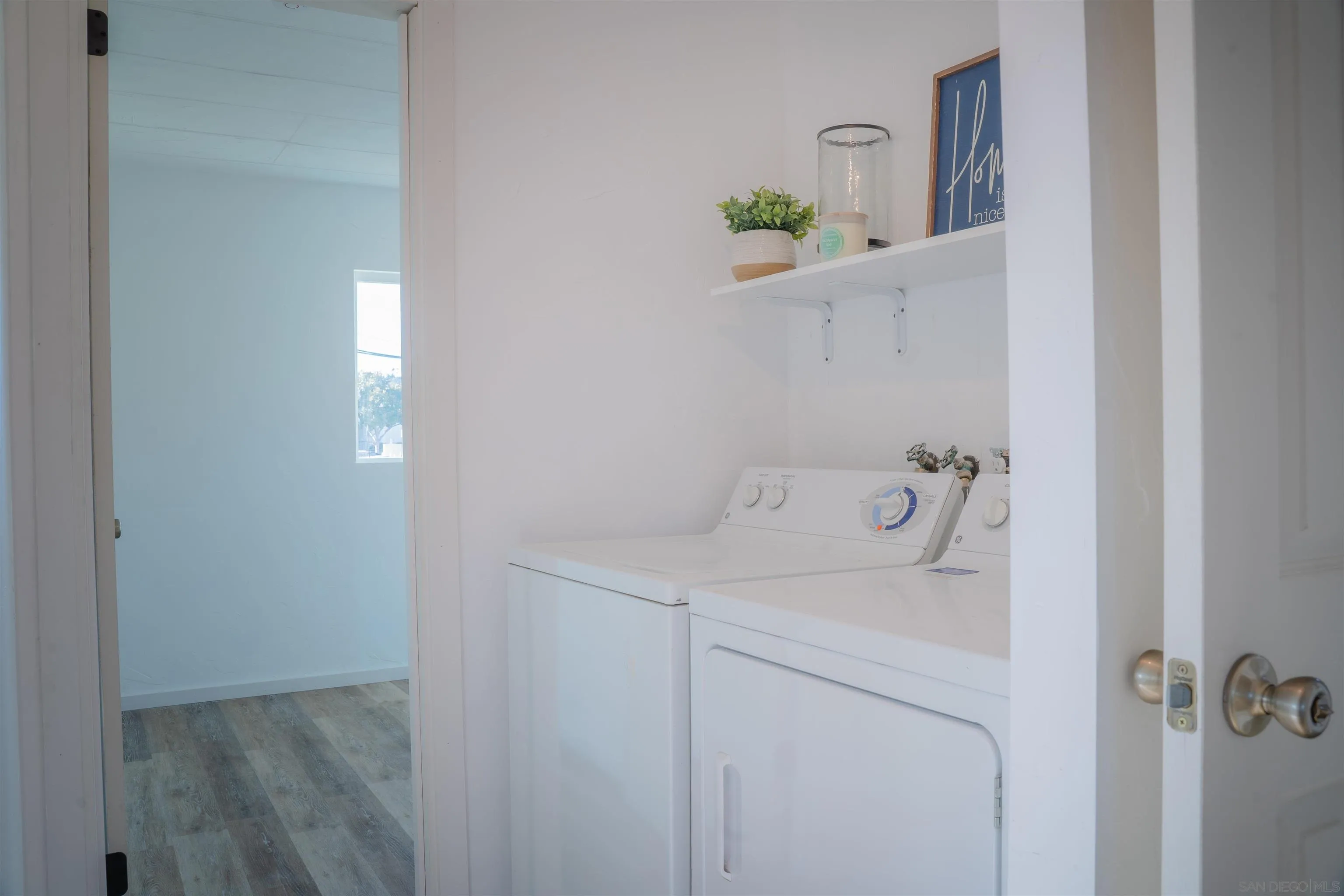 3221 Bancroft Drive, Unit SPC 1 Spring Valley, CA 91977 - Photo 17 of 22 a utility room with dryer and washer