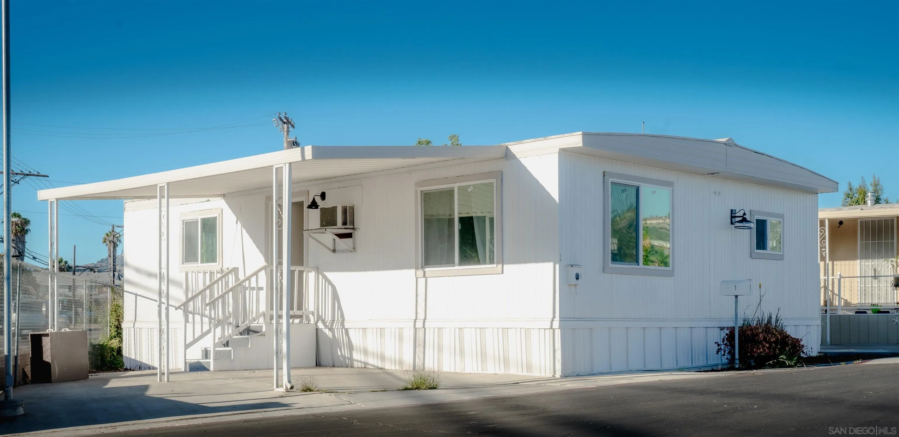 3221 Bancroft Drive, Unit SPC 1 Spring Valley, CA 91977 - Photo 21 of 22 a front view of a house with a garage