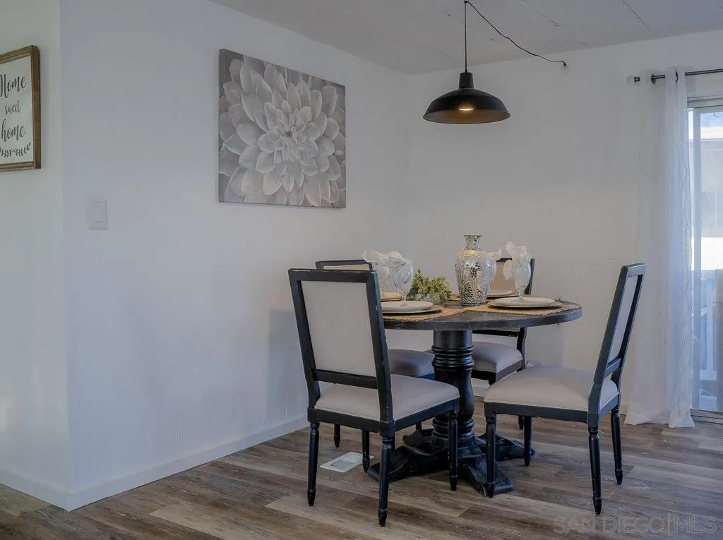3221 Bancroft Drive, Unit SPC 1 Spring Valley, CA 91977 - Photo 7 of 22 a view of a dining room with furniture and wooden floor