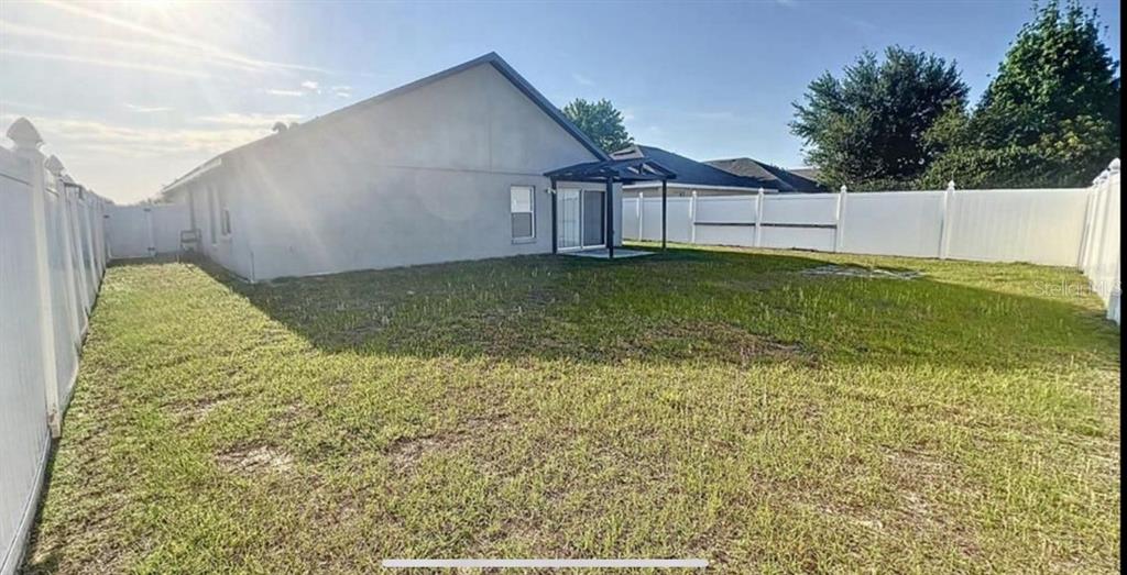 167 Haversham Way Davenport, FL 33897 - Photo 7 of 7 a house view with a backyard space