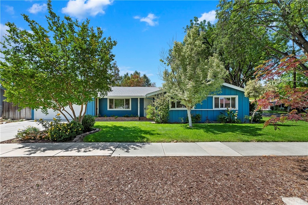 4834 Cliffside Drive Riverside, CA 92506 - Photo 1 of 1 a front view of a house with a yard and a garage