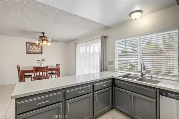 a kitchen with a sink and a window