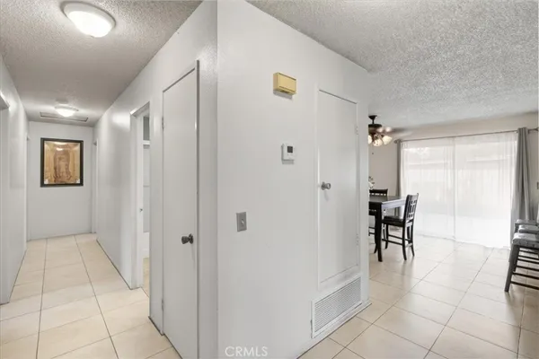 a view of a hallway with dining area