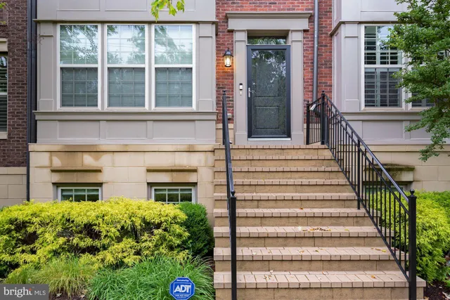 front view of a house with a large window