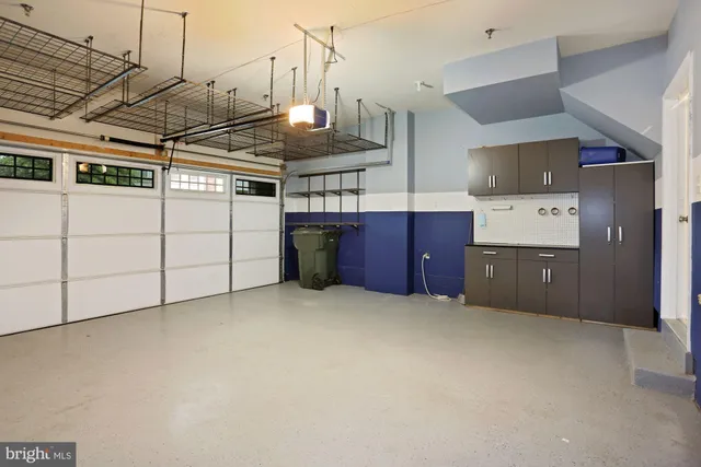 a view of a kitchen with stainless steel appliances granite countertop a stove and a refrigerator
