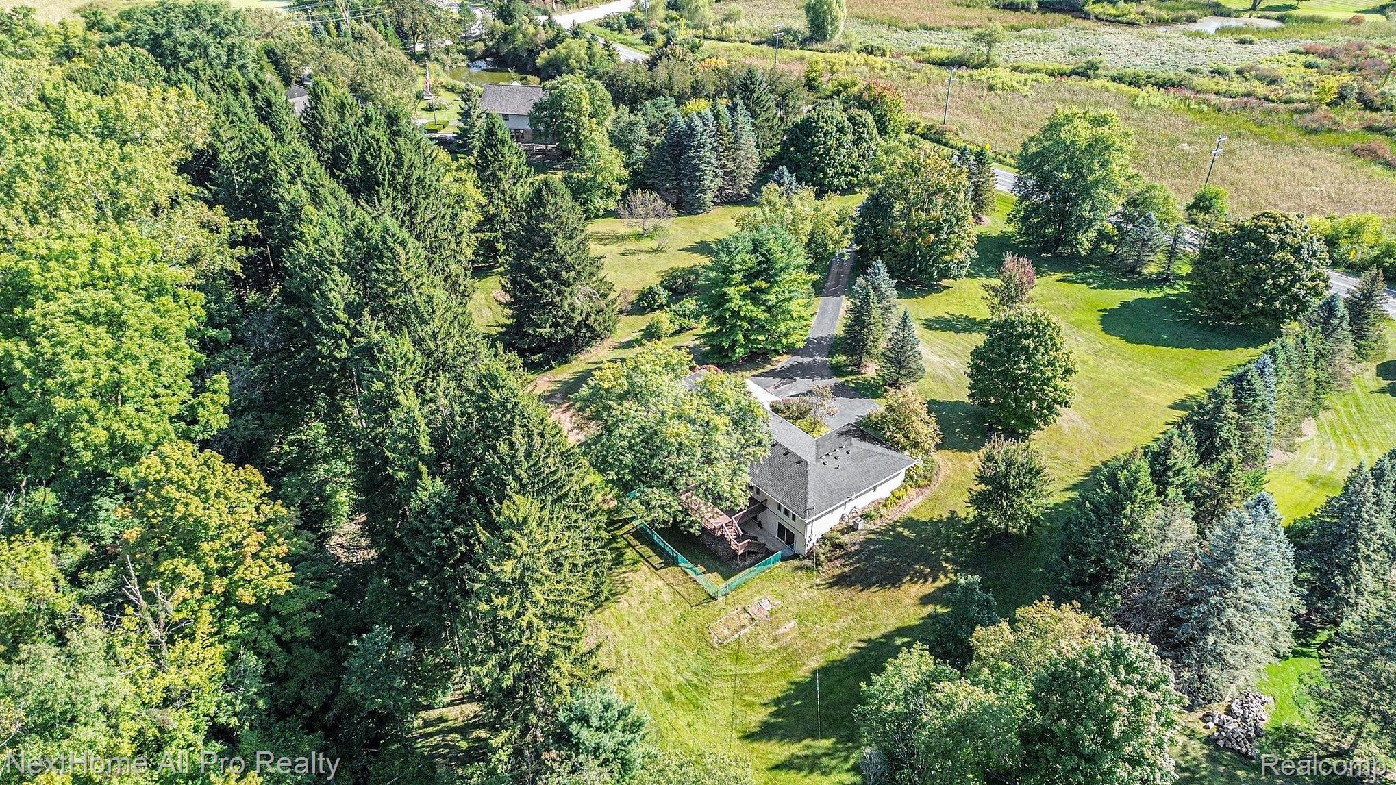 7195 Curtis Road Northville, MI 48168 - Photo 60 of 70 Aerial view highlighting the home and its beautiful setting.
