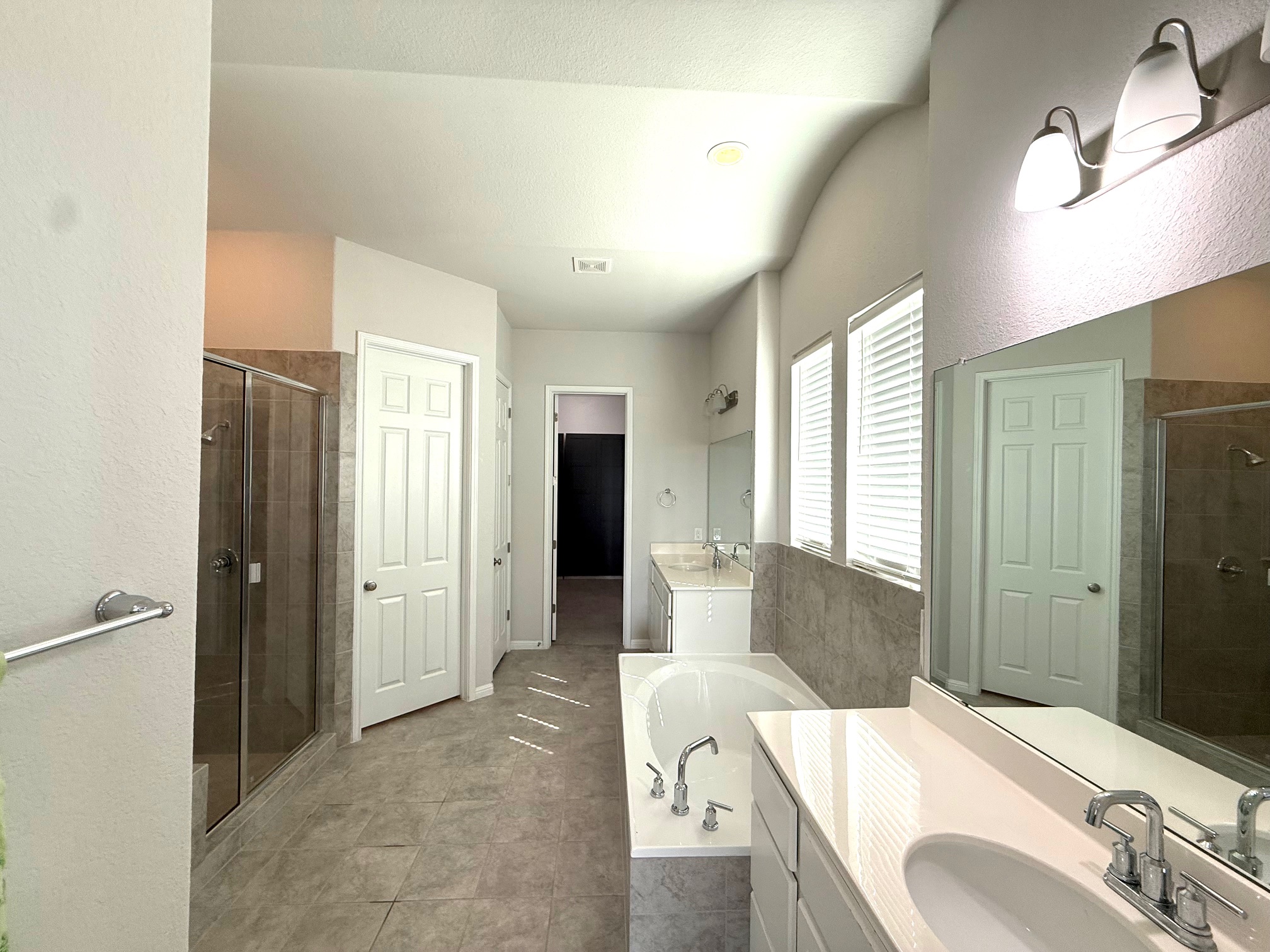 3625 Garrano Bend Leander, TX 78641 - Photo 15 of 31 a spacious bathroom with a tub sink and mirror