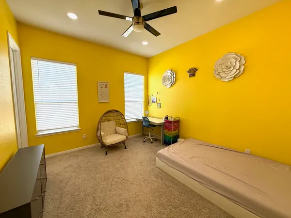 a view of a livingroom with furniture and windows