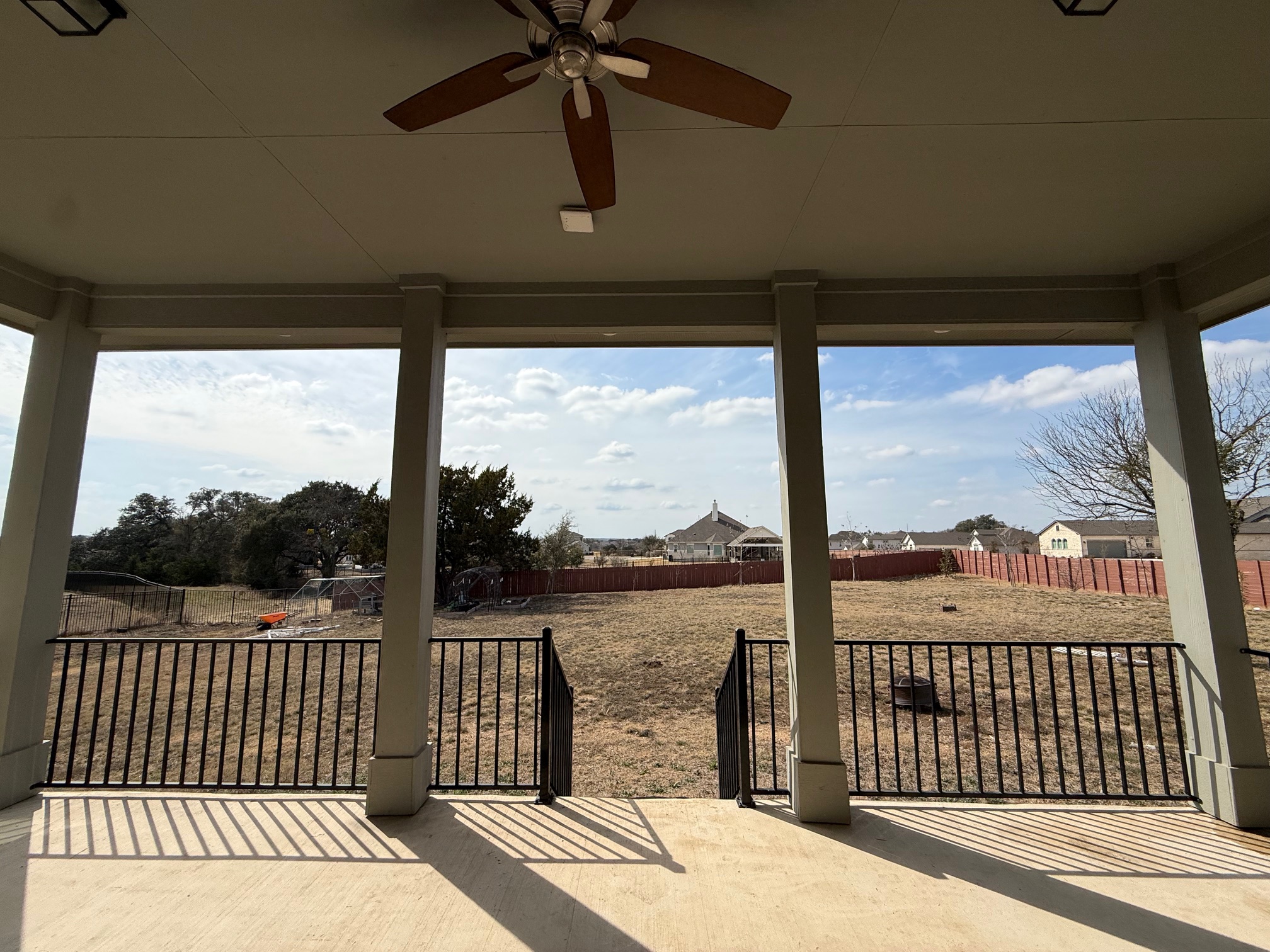 3625 Garrano Bend Leander, TX 78641 - Photo 26 of 31 a view of a balcony with floor to ceiling window wooden floor and fence