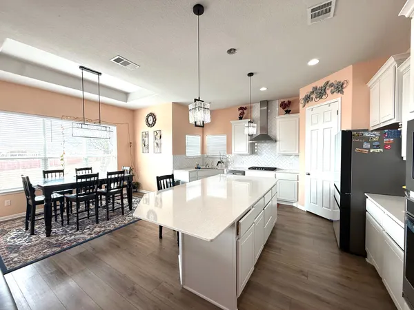 a view of kitchen and dining area with furniture