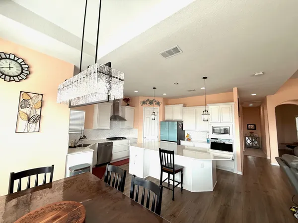 a living room with furniture window and wooden floor