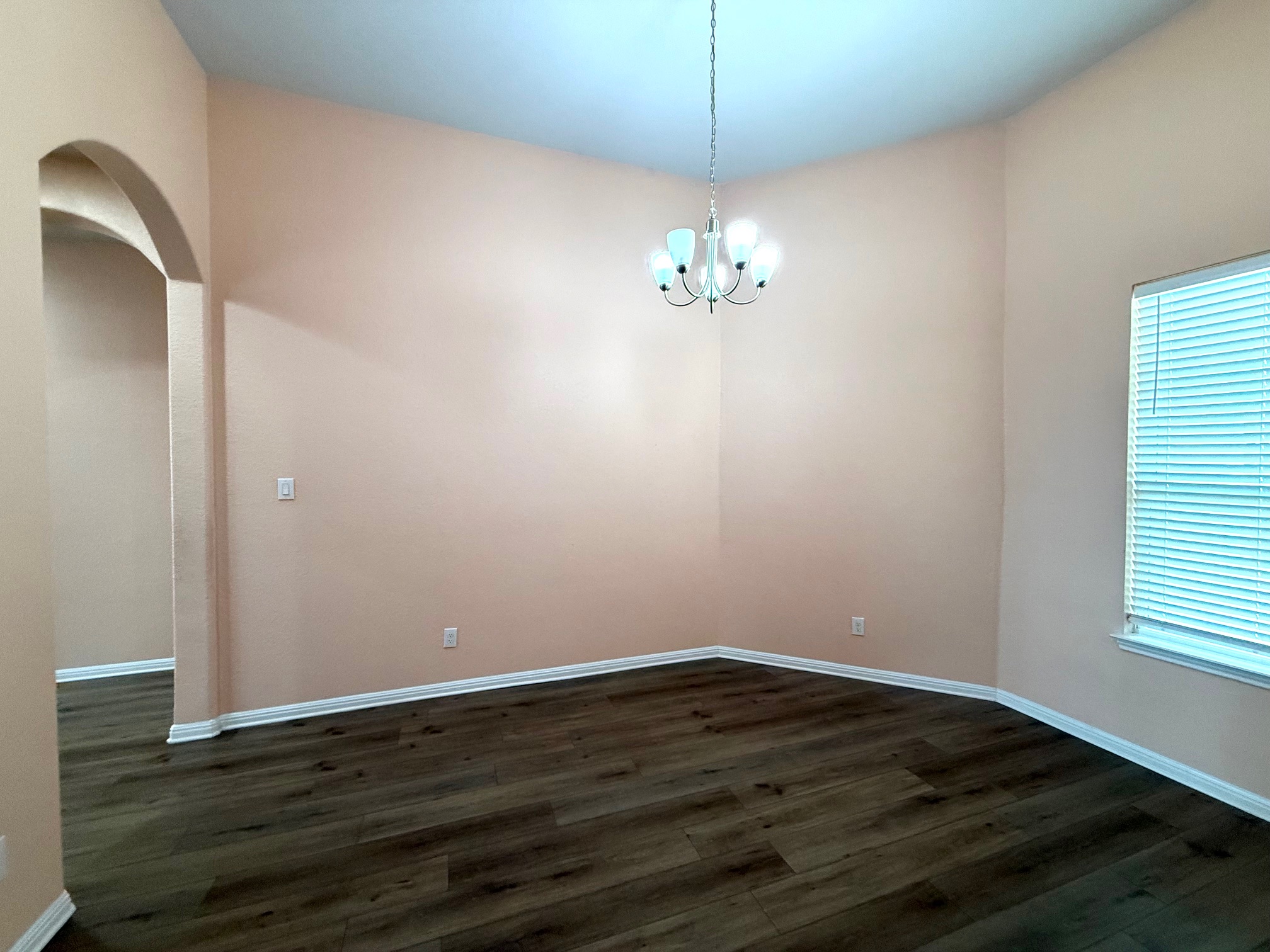 3625 Garrano Bend Leander, TX 78641 - Photo 8 of 31 a view of empty room with wooden floor and chandelier