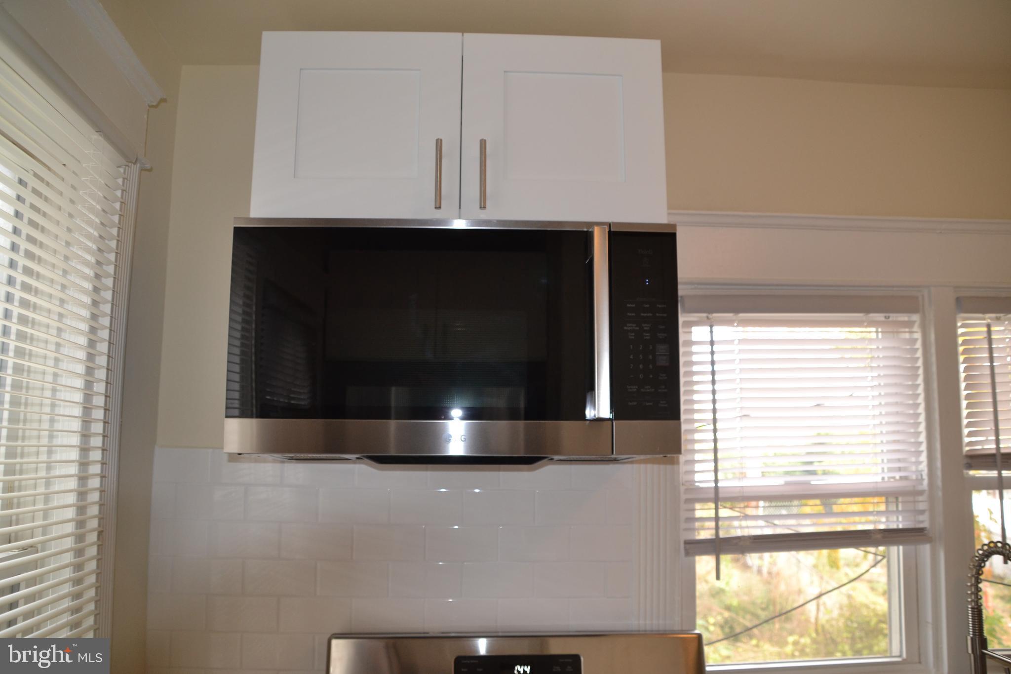 243 Coverly Road Lansdowne, PA 19050 - Photo 11 of 31 a close view of wooden cabinets and fireplace