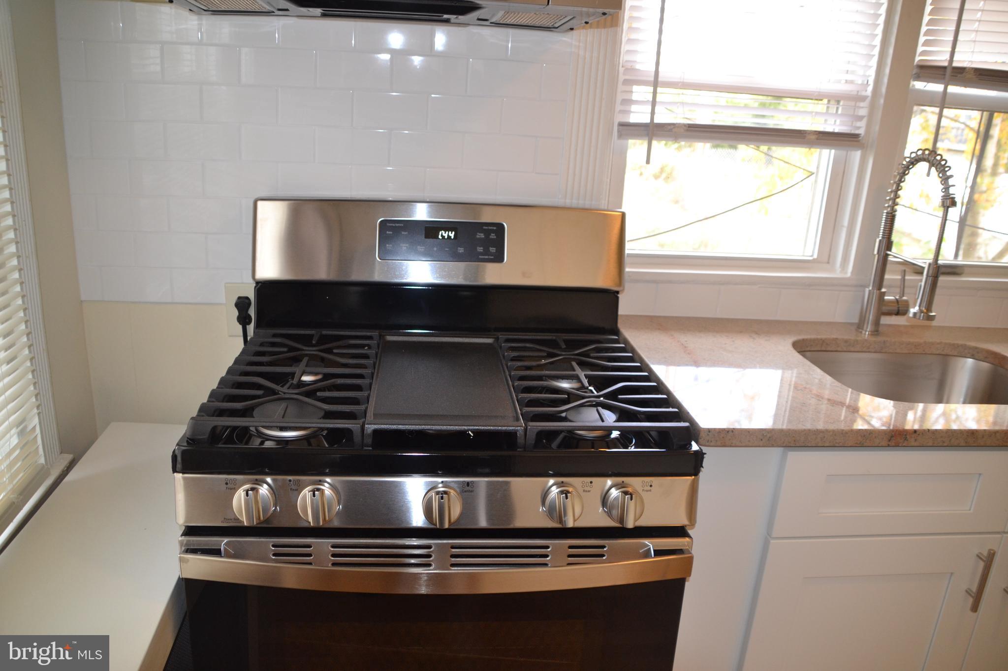 243 Coverly Road Lansdowne, PA 19050 - Photo 10 of 31 a stove top oven sitting inside of a kitchen