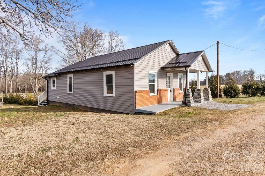 4582 Burkemont Road Morganton, NC 28655 - Photo 2 of 11 a view of a house with a yard