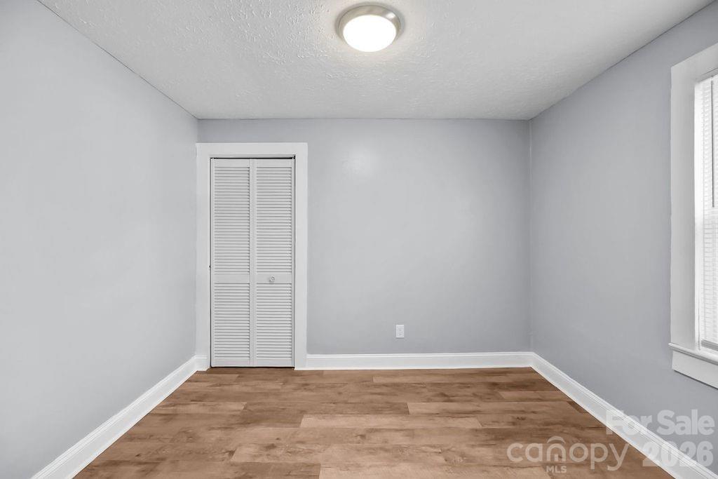 4582 Burkemont Road Morganton, NC 28655 - Photo 8 of 11 wooden floor in a empty room