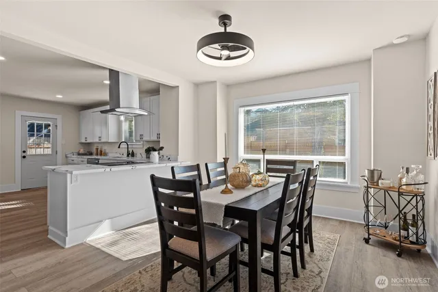 a dining room with furniture and window