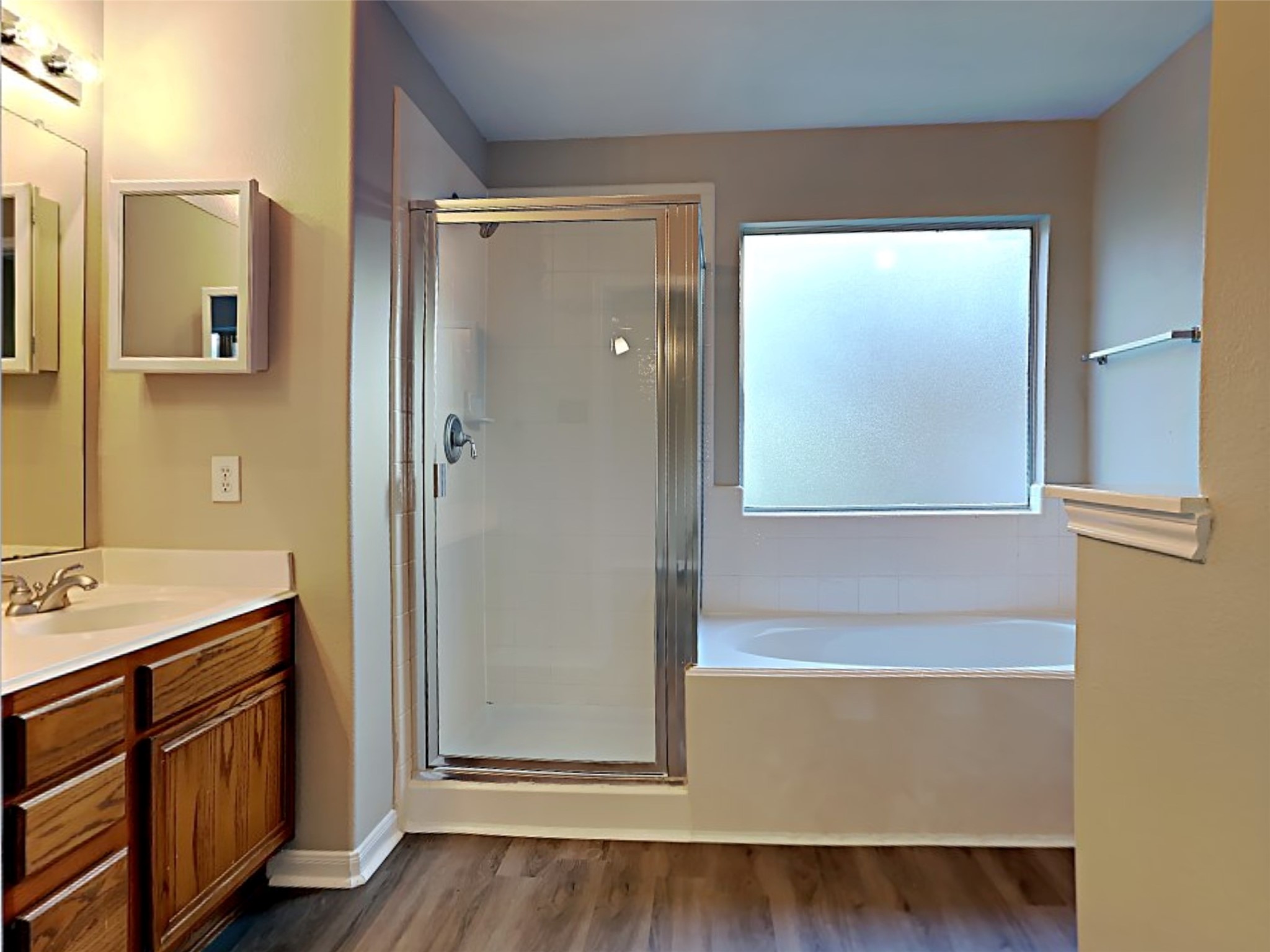15507 Riford Drive Cypress, TX 77429 - Photo 12 of 15 a bathroom with a bathtub and a sink
