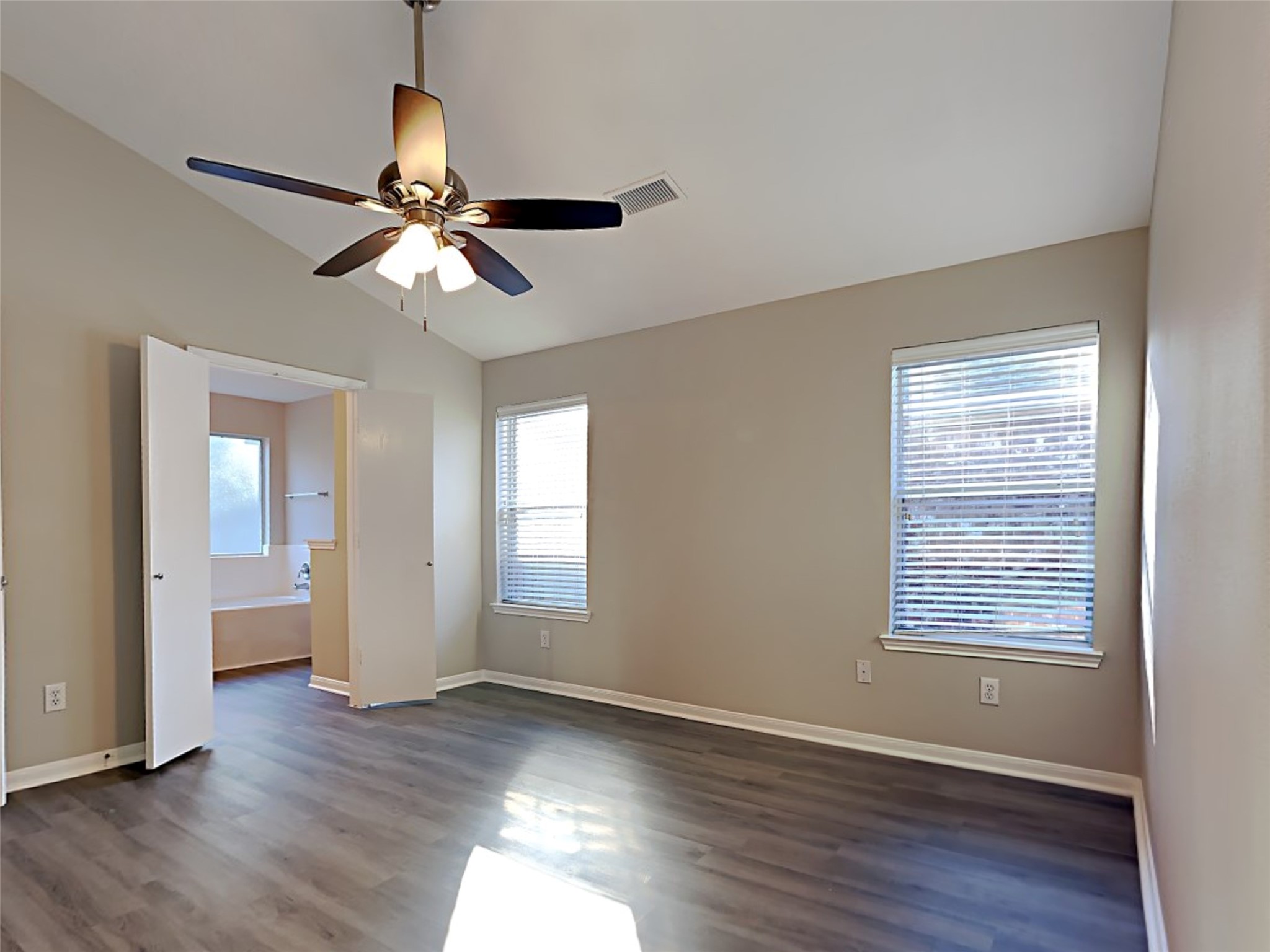 15507 Riford Drive Cypress, TX 77429 - Photo 8 of 15 a view of an empty room with wooden floor and a window