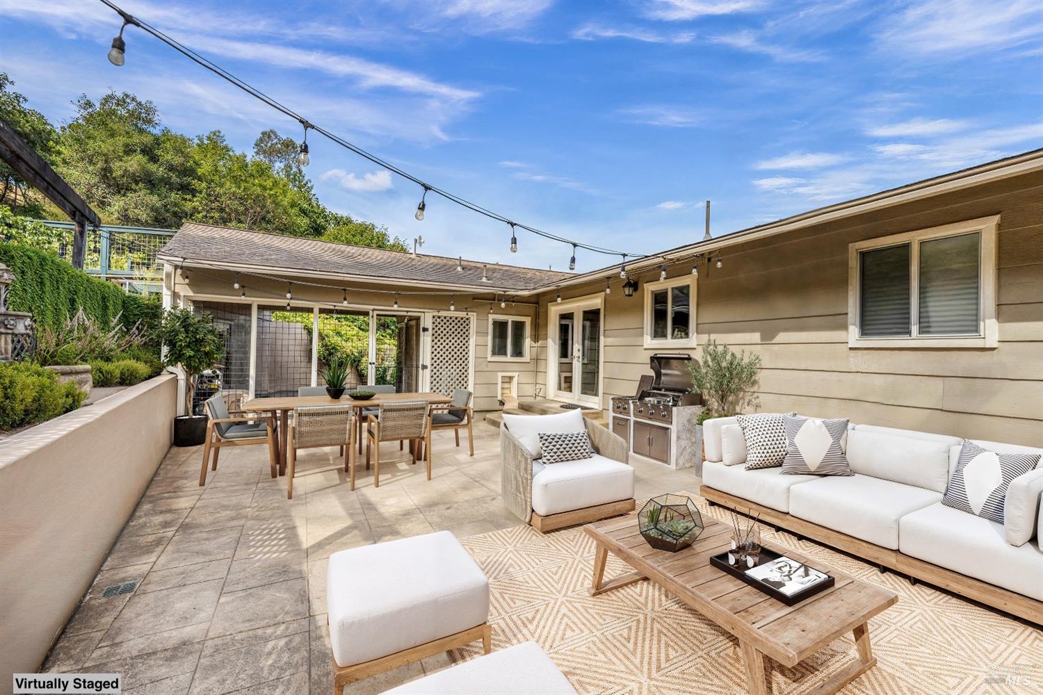 1389 Canyon Road Geyserville, CA 95441 - Photo 34 of 59 a view of a patio with couches table and chairs and potted plants