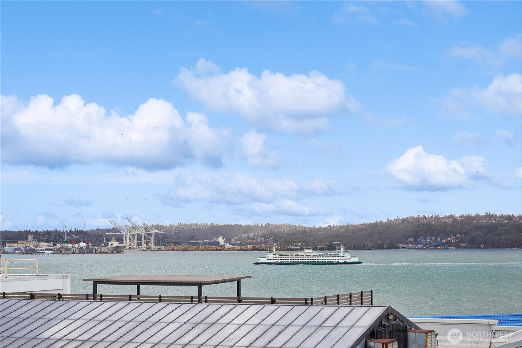 2716 Elliott Avenue, Unit 802 Seattle, WA 98121 - Photo 1 of 34 a view of a lake with a city