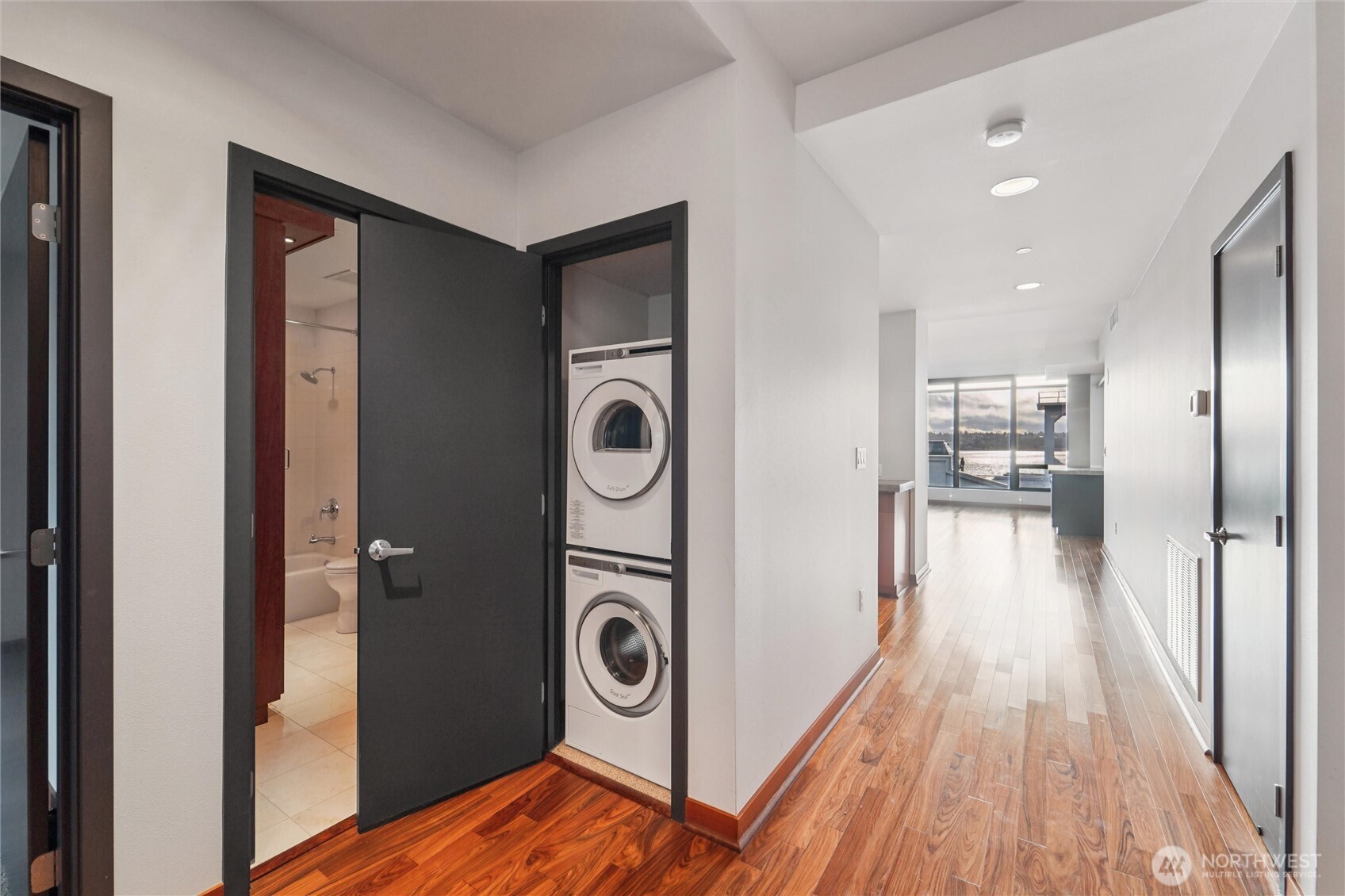 2716 Elliott Avenue, Unit 802 Seattle, WA 98121 - Photo 27 of 34 a view of a hallway with washer and dryer