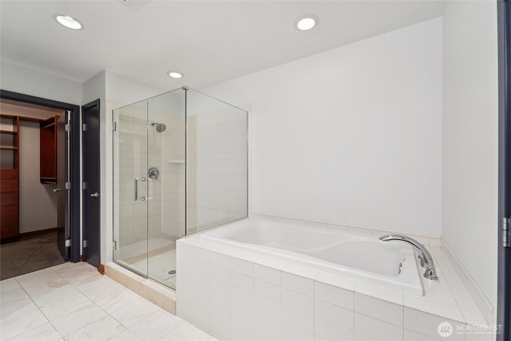2716 Elliott Avenue, Unit 802 Seattle, WA 98121 - Photo 29 of 34 a bathroom with a bathtub and a shower