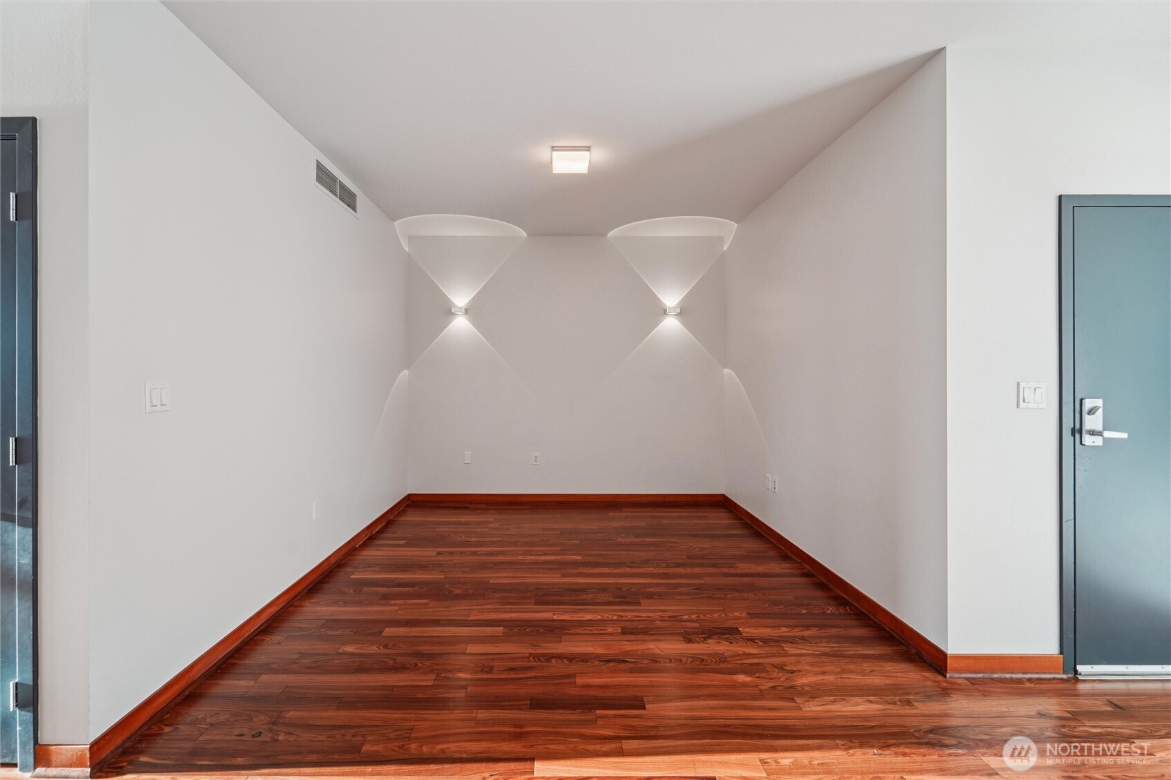 2716 Elliott Avenue, Unit 802 Seattle, WA 98121 - Photo 31 of 34 a view of a hallway with wooden floor