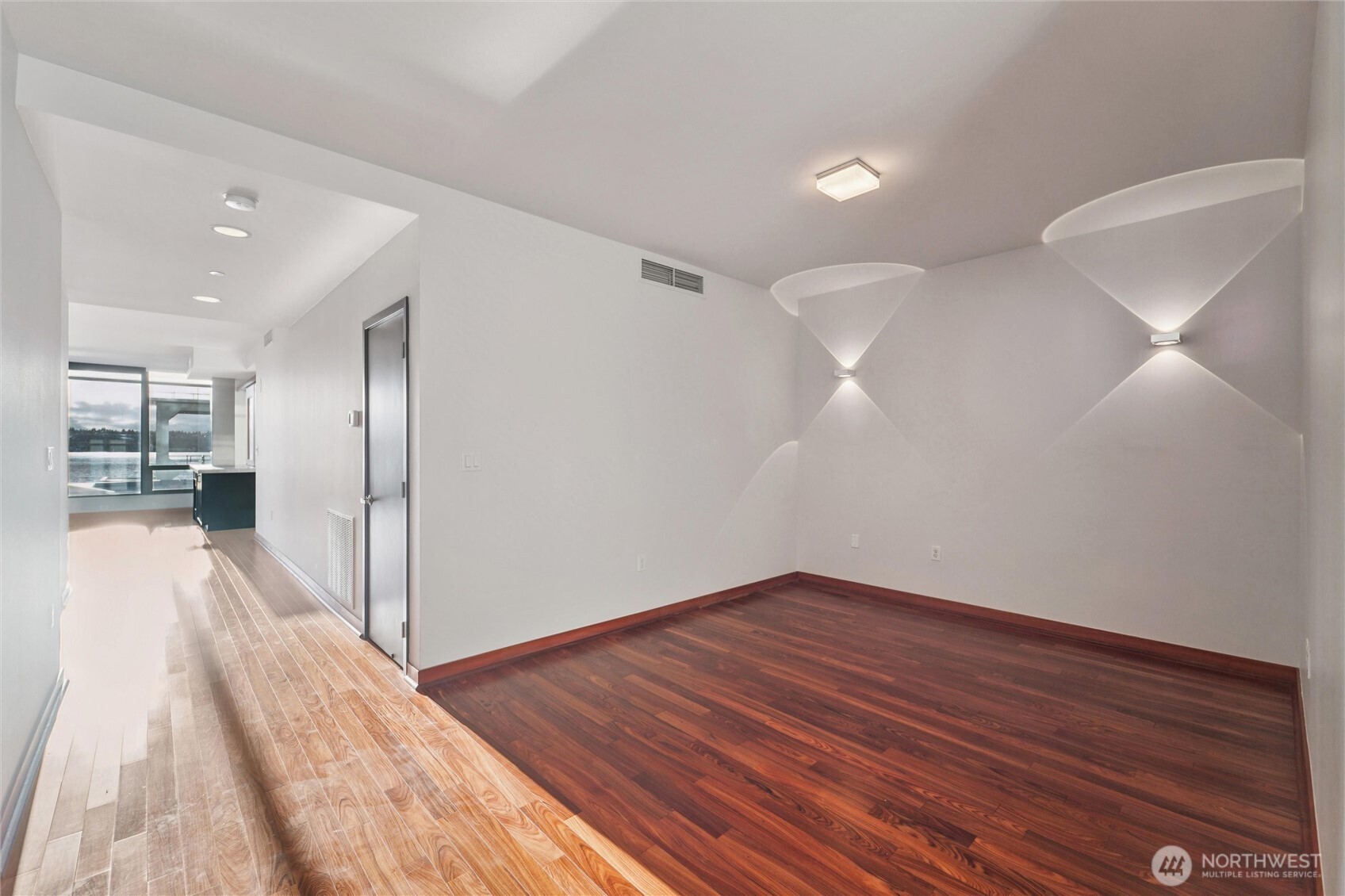 2716 Elliott Avenue, Unit 802 Seattle, WA 98121 - Photo 33 of 34 a view of a room with wooden floor and a large window