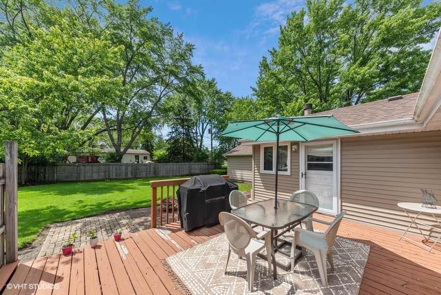 14 Aldine Road Lake Zurich, IL 60047 - Photo 13 of 15 a patio with wooden floor table and chairs
