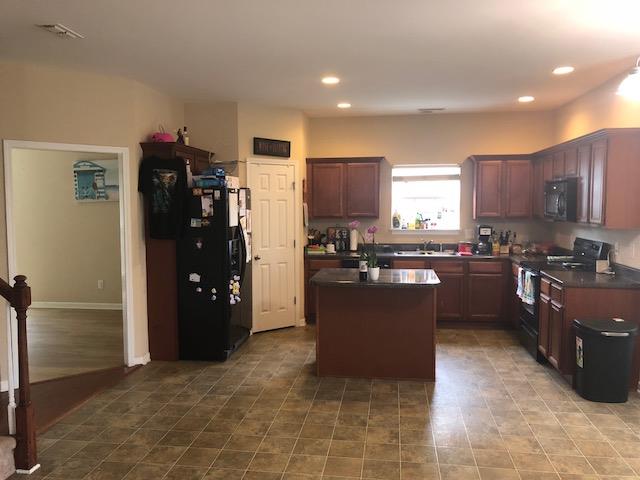 Large kitchen with island and lots of cabinet space