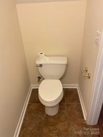 a bathroom with a toilet and a sink