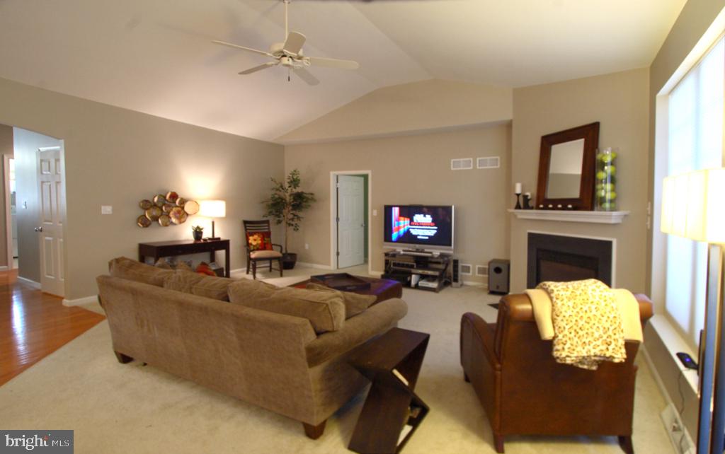 1013 Sloan Street Lititz, PA 17543 - Photo 8 of 22 a living room with fireplace furniture and a flat screen tv