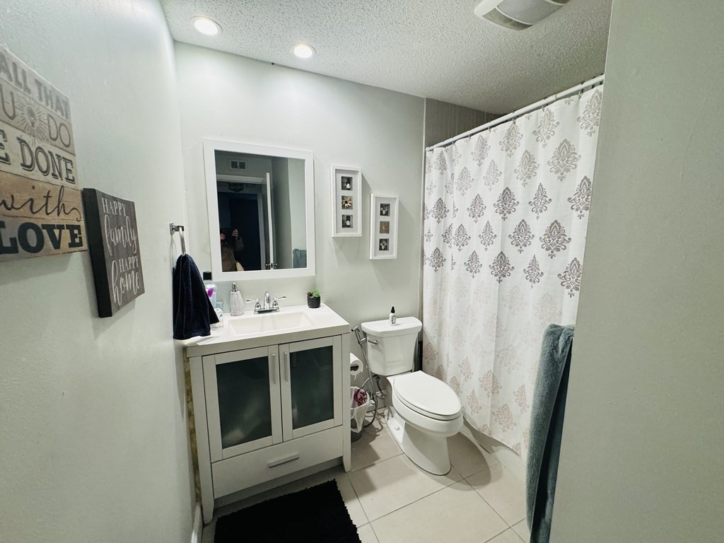 6 Shadowbrook Lane, Unit 59 Milford, MA 01757 - Photo 17 of 25 a view of bathroom with a toilet sink and mirror