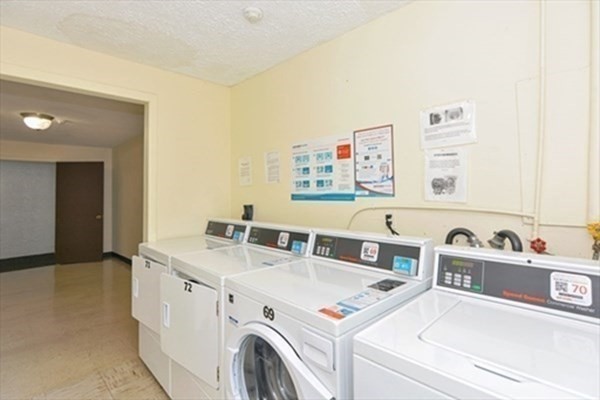 6 Shadowbrook Lane, Unit 59 Milford, MA 01757 - Photo 18 of 25 a utility room with dryer and washer