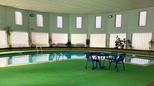 6 Shadowbrook Lane, Unit 59 Milford, MA 01757 - Photo 21 of 25 a view of swimming pool with outdoor seating and lake view