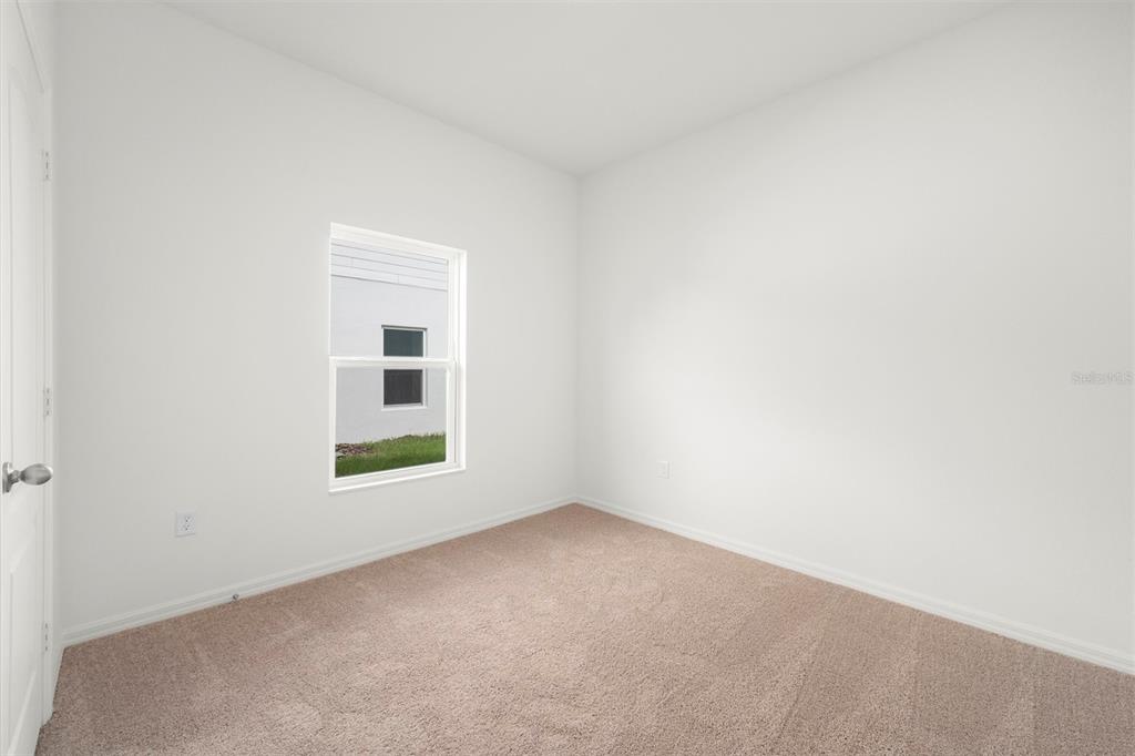 13300 Tula Loop Astatula, FL 34705 - Photo 15 of 18 an empty room with a window