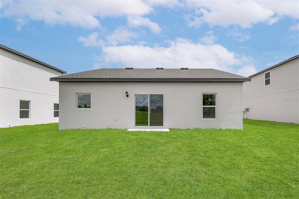 13300 Tula Loop Astatula, FL 34705 - Photo 17 of 18 a house view with a garden space