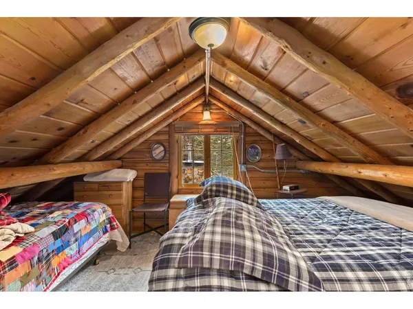 a bedroom with bed and balcony