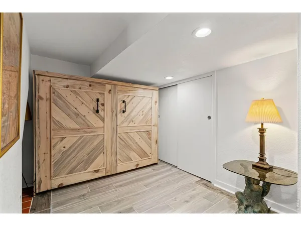 a view of an entryway with wooden floor