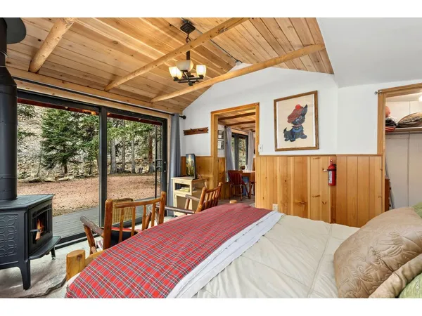 a bed room with a bed and a chandelier