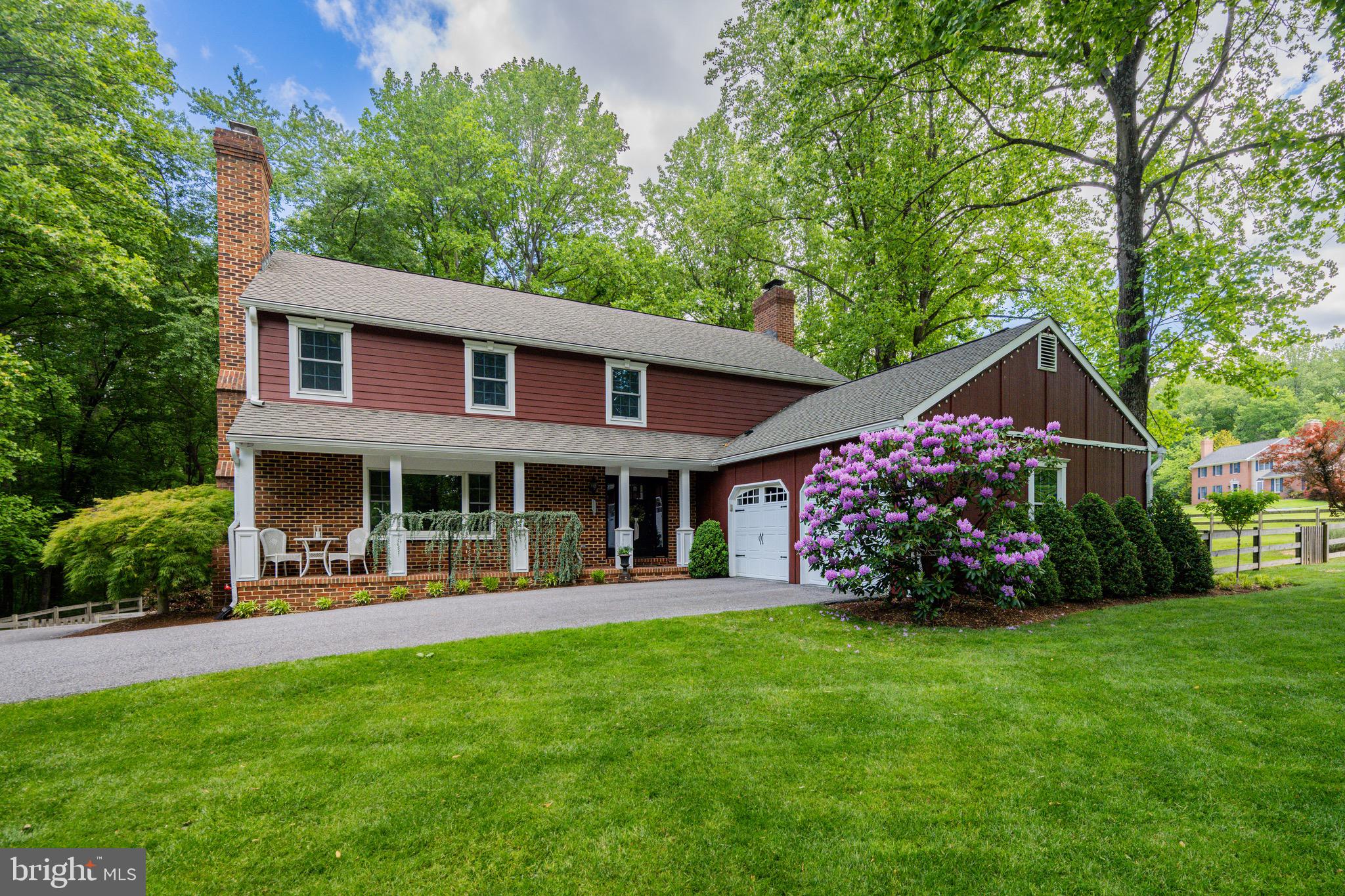 2 Wetherbee Court Phoenix, MD 21131 - Photo 1 of 19 a front view of a house with porch and garden