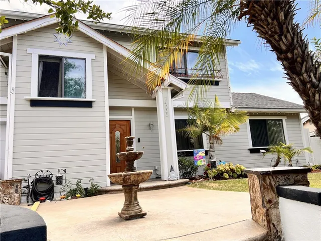 a front view of a house with outdoor seating