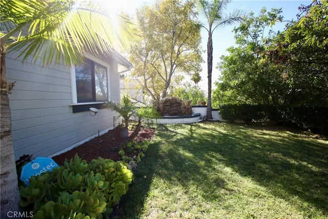 a backyard of a house with lots of green space