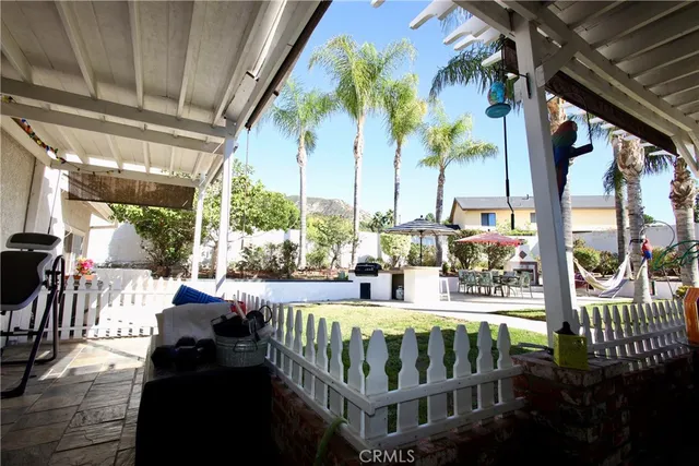 a view of swimming pool with a table and chairs