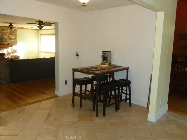 a view of a dining room with furniture and a window