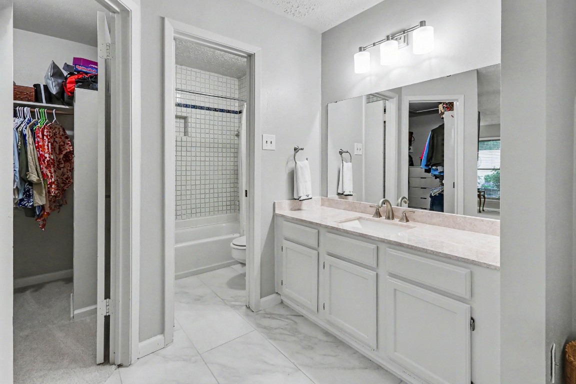 8327 Spring Wind Drive Houston, TX 77040 - Photo 16 of 30 Bath has updated quartz countertops, lighting and fixtures