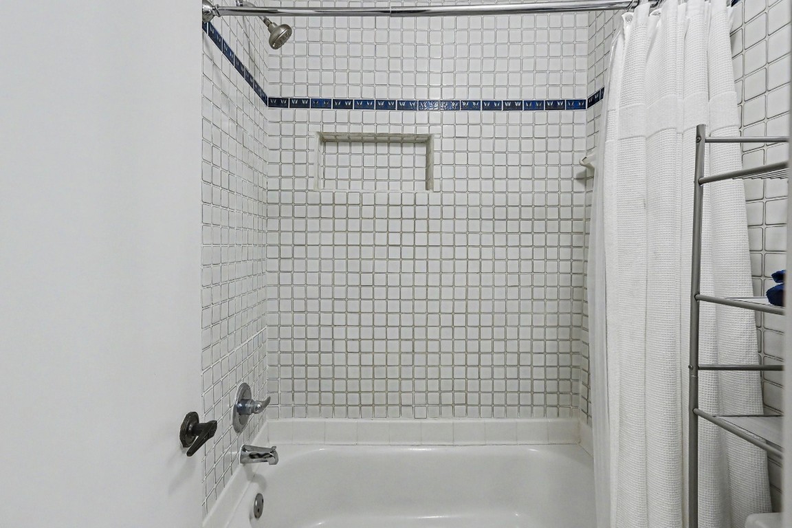 8327 Spring Wind Drive Houston, TX 77040 - Photo 20 of 30 Tub/shower combo with unique tile